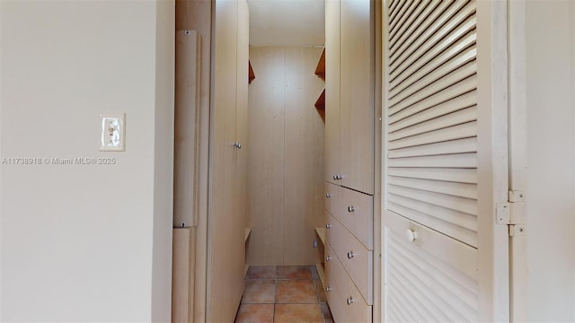 corridor featuring light tile patterned flooring