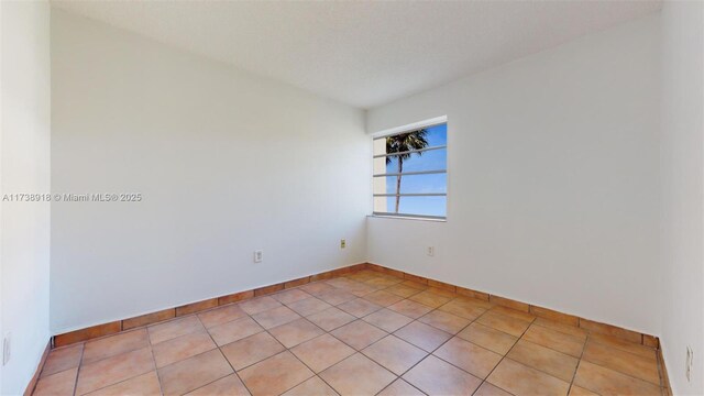 view of tiled spare room