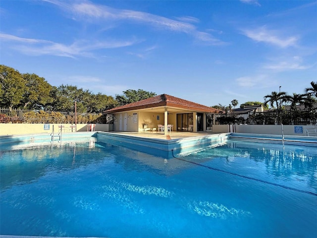 view of swimming pool with a patio area