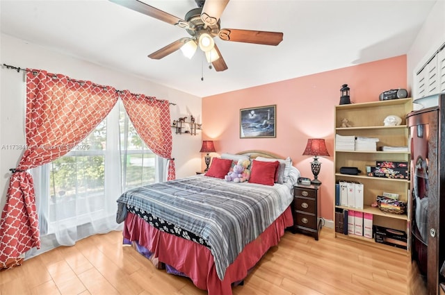 bedroom featuring light hardwood / wood-style flooring and ceiling fan