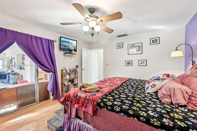 bedroom featuring ceiling fan and light hardwood / wood-style floors