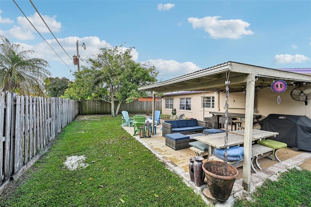 view of yard featuring an outdoor living space and a patio area