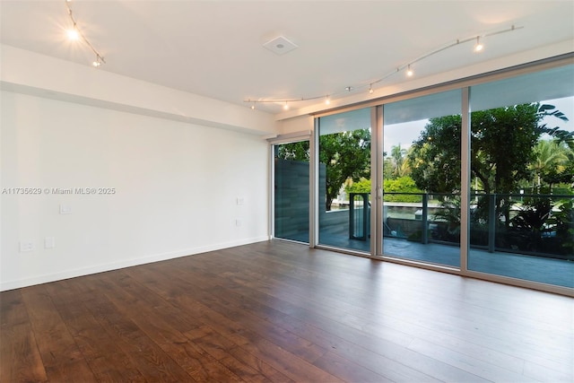 spare room with wood-type flooring