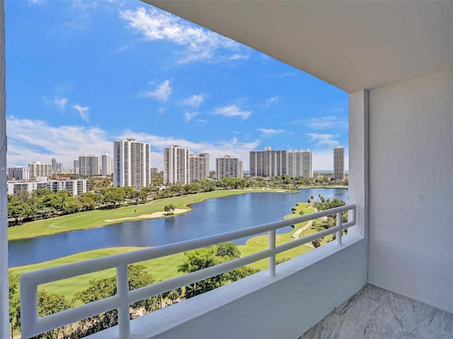 balcony featuring a water view