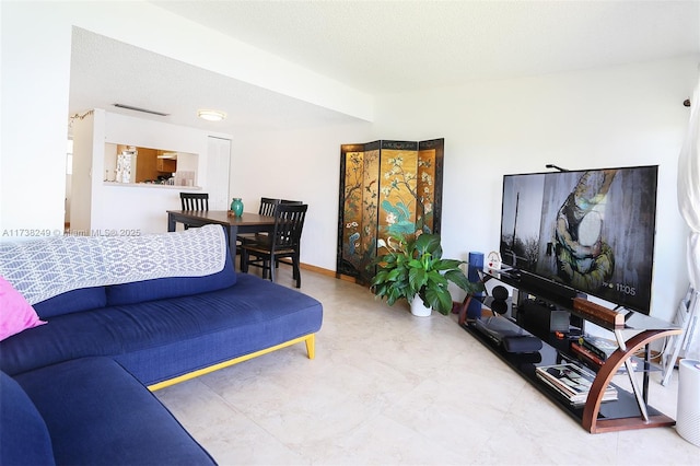 living room featuring a textured ceiling