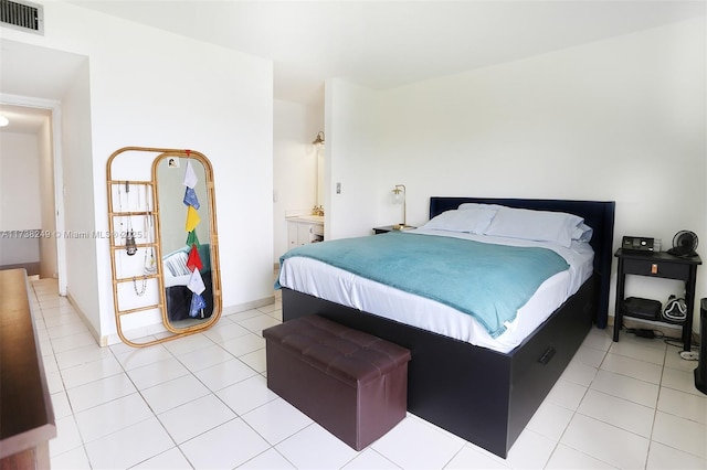 bedroom with light tile patterned floors