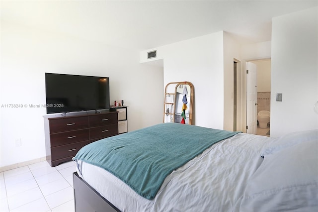 315 NW 109th Ave Unit 205, Miami, FL 33172 - bedroom with visible vents, ensuite bathroom, and light tile patterned floors