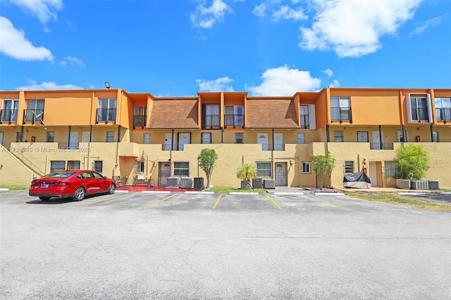 315 NW 109th Ave Unit 205, Miami, FL 33172 - view of building exterior with uncovered parking and cooling unit