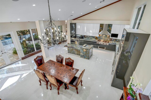 living room featuring a raised ceiling, crown molding, ceiling fan, and french doors