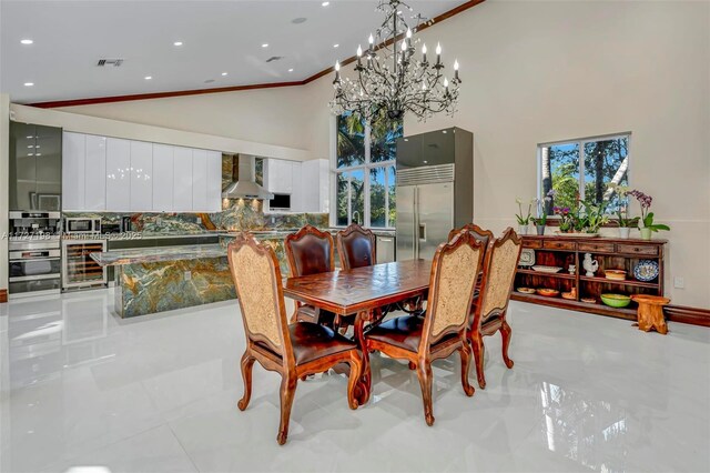 living room with ornamental molding, a raised ceiling, ceiling fan, and french doors