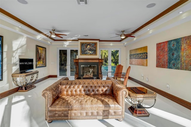 living room featuring visible vents, crown molding, baseboards, french doors, and a ceiling fan