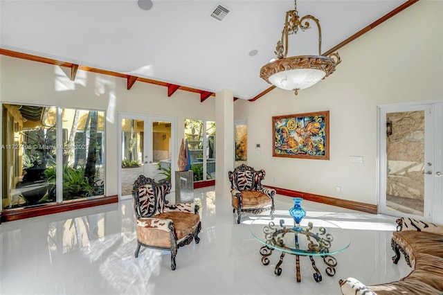 living room featuring lofted ceiling and french doors