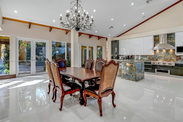 dining area featuring high vaulted ceiling and french doors