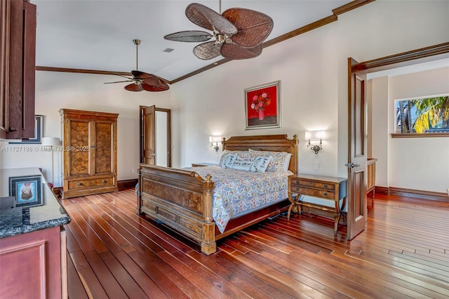 bedroom with visible vents, baseboards, hardwood / wood-style floors, and crown molding