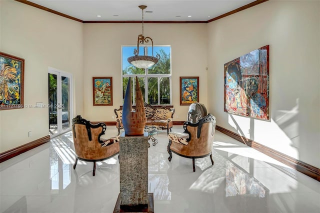 sitting room featuring a high ceiling, french doors, crown molding, and baseboards