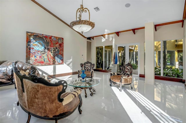 sitting room featuring beam ceiling, visible vents, french doors, and ornamental molding