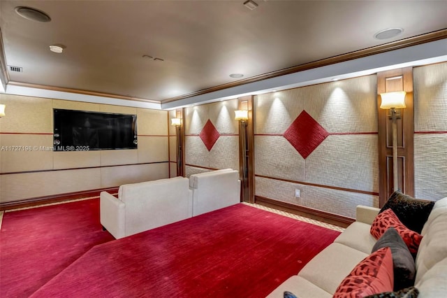 cinema room with visible vents and crown molding