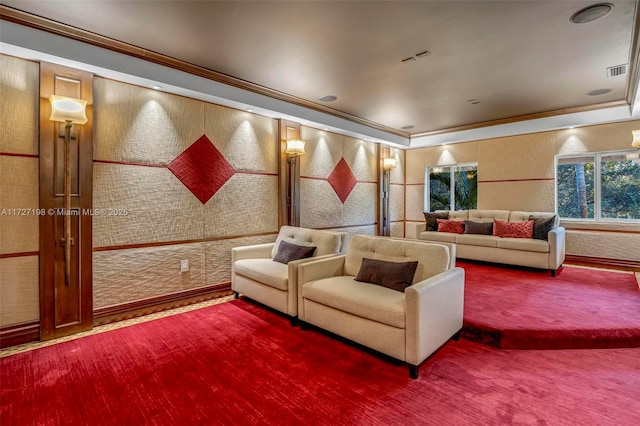 carpeted cinema featuring visible vents and crown molding