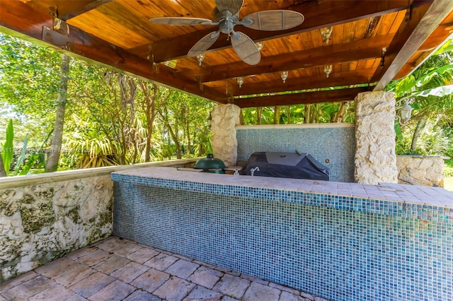 view of patio / terrace with a ceiling fan and grilling area