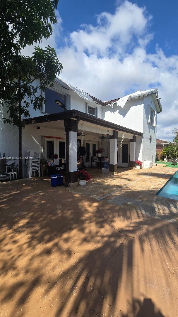 rear view of property featuring a patio