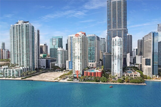 1155 Brickell Bay Dr Unit 704, Miami, FL 33131 - view of swimming pool featuring a view of skyline and a water view