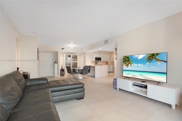 1155 Brickell Bay Dr Unit 704, Miami, FL 33131 - living area with light tile patterned floors