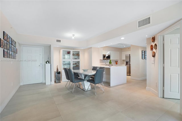 dining space featuring sink