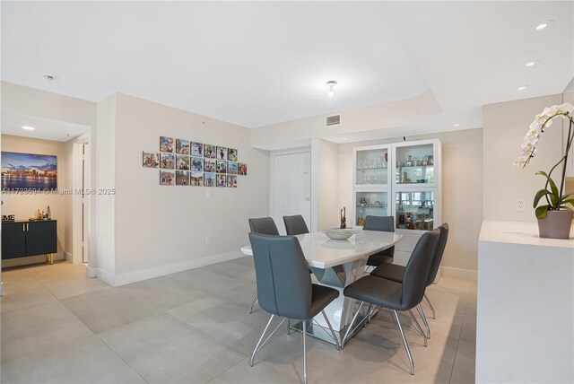 1155 Brickell Bay Dr Unit 704, Miami, FL 33131 - dining room featuring baseboards, recessed lighting, and light tile patterned floors
