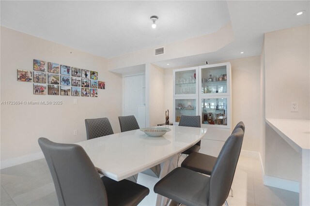 1155 Brickell Bay Dr Unit 704, Miami, FL 33131 - dining space featuring light tile patterned floors, baseboards, and recessed lighting