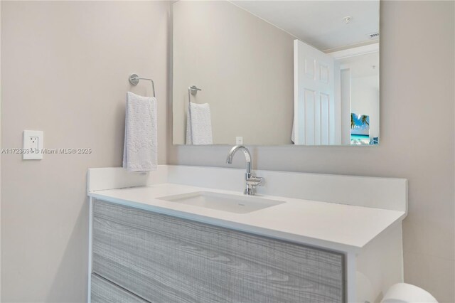 1155 Brickell Bay Dr Unit 704, Miami, FL 33131 - half bath featuring vanity and toilet