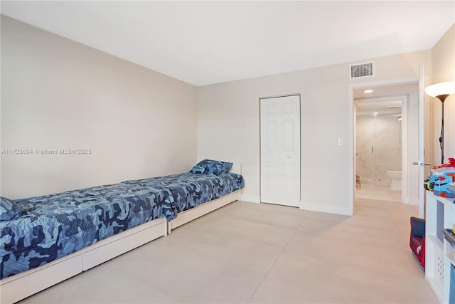 1155 Brickell Bay Dr Unit 704, Miami, FL 33131 - bedroom featuring light tile patterned floors and baseboards