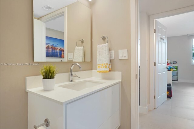 bathroom with vanity and tile patterned flooring