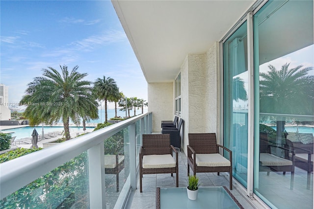 balcony featuring a water view