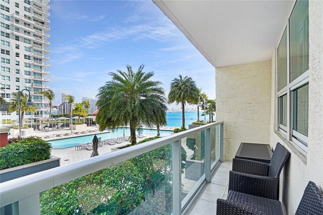 1155 Brickell Bay Dr Unit 704, Miami, FL 33131 - balcony with a water view and view of pool area