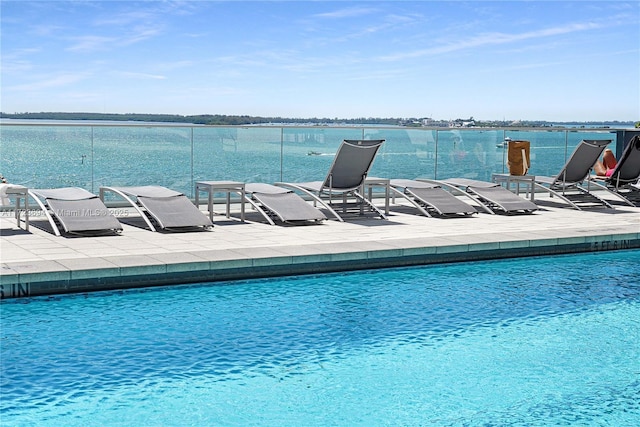 1155 Brickell Bay Dr Unit 704, Miami, FL 33131 - community pool featuring a patio and a water view
