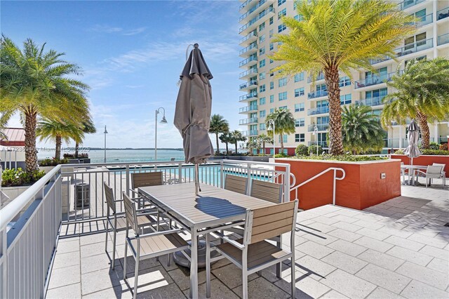 1155 Brickell Bay Dr Unit 704, Miami, FL 33131 - view of patio / terrace with a water view and outdoor dining space
