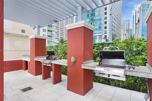 1155 Brickell Bay Dr Unit 704, Miami, FL 33131 - view of patio / terrace with a view of city