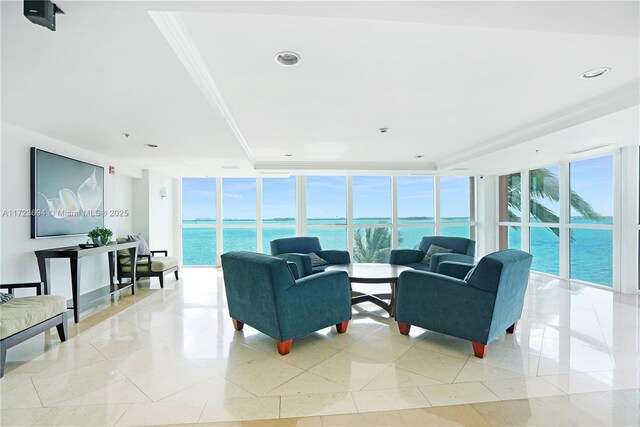 1155 Brickell Bay Dr Unit 704, Miami, FL 33131 - living area with floor to ceiling windows, a water view, light tile patterned floors, ornamental molding, and recessed lighting