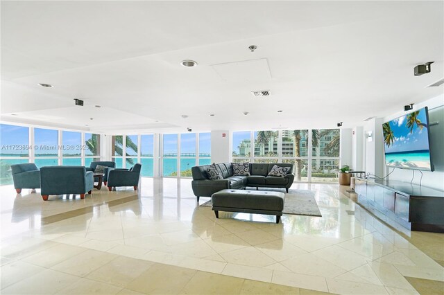 1155 Brickell Bay Dr Unit 704, Miami, FL 33131 - living room with expansive windows and light tile patterned floors