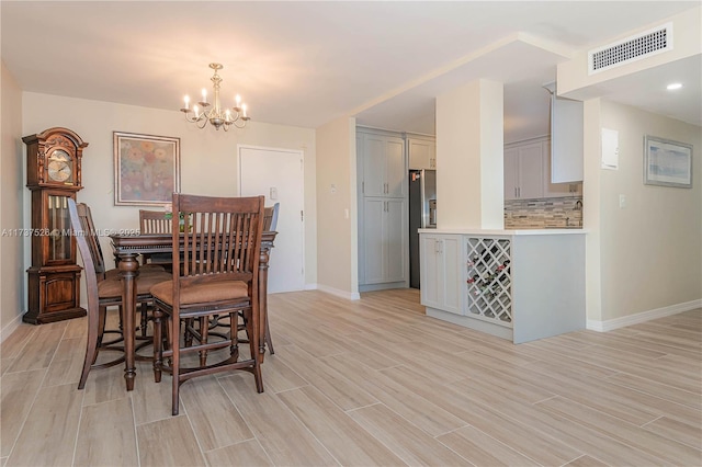 dining area with a notable chandelier