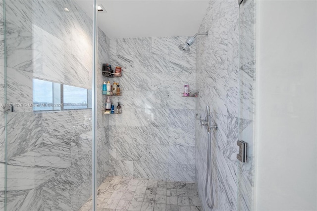 bathroom with tiled shower