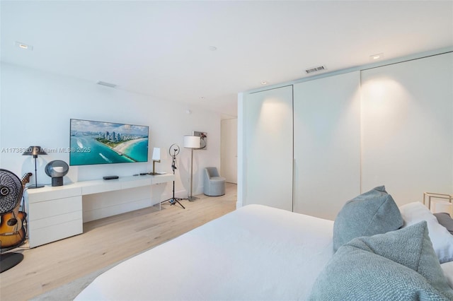 bedroom with light wood-type flooring