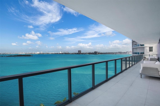 balcony featuring a water view