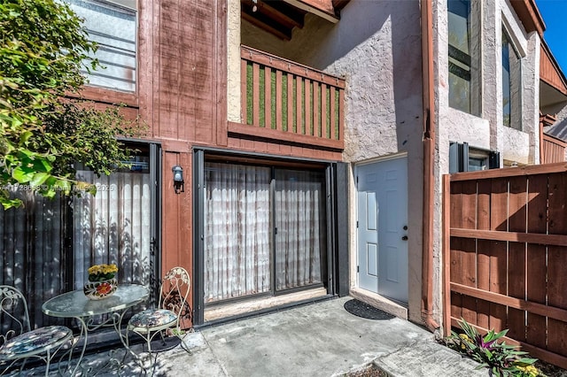 doorway to property featuring a balcony