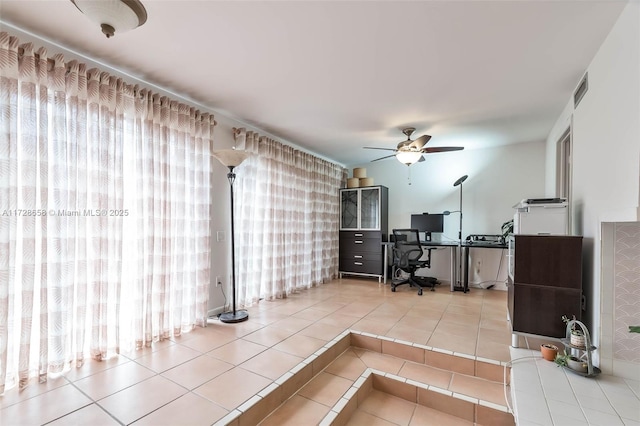 tiled home office with ceiling fan