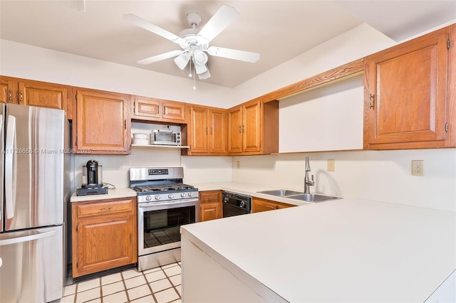 kitchen with ceiling fan, stainless steel appliances, and sink