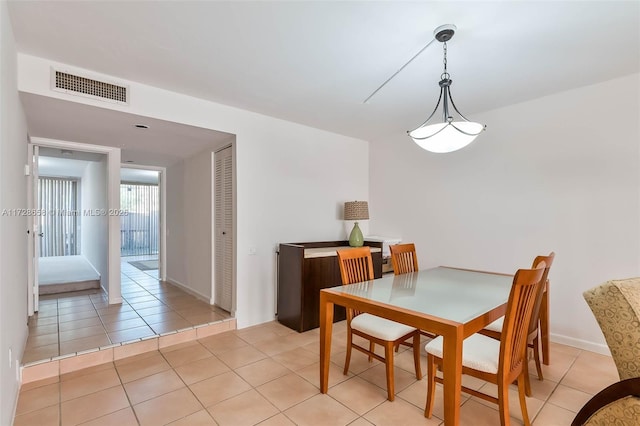 dining room with light tile patterned flooring