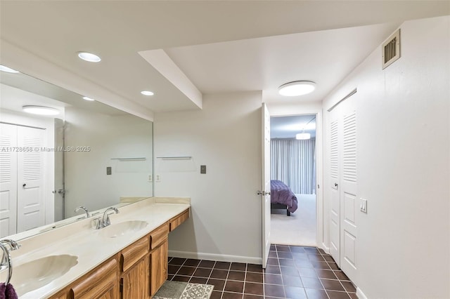 bathroom featuring vanity and tile patterned flooring