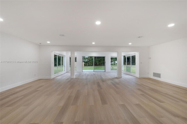 unfurnished living room featuring light hardwood / wood-style floors