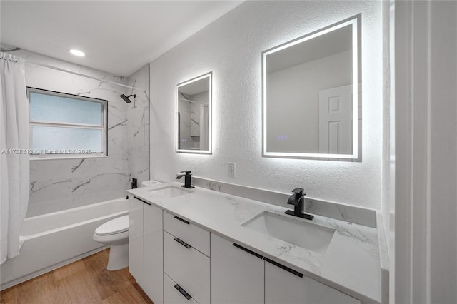 full bathroom featuring shower / bath combination with curtain, vanity, toilet, and hardwood / wood-style floors